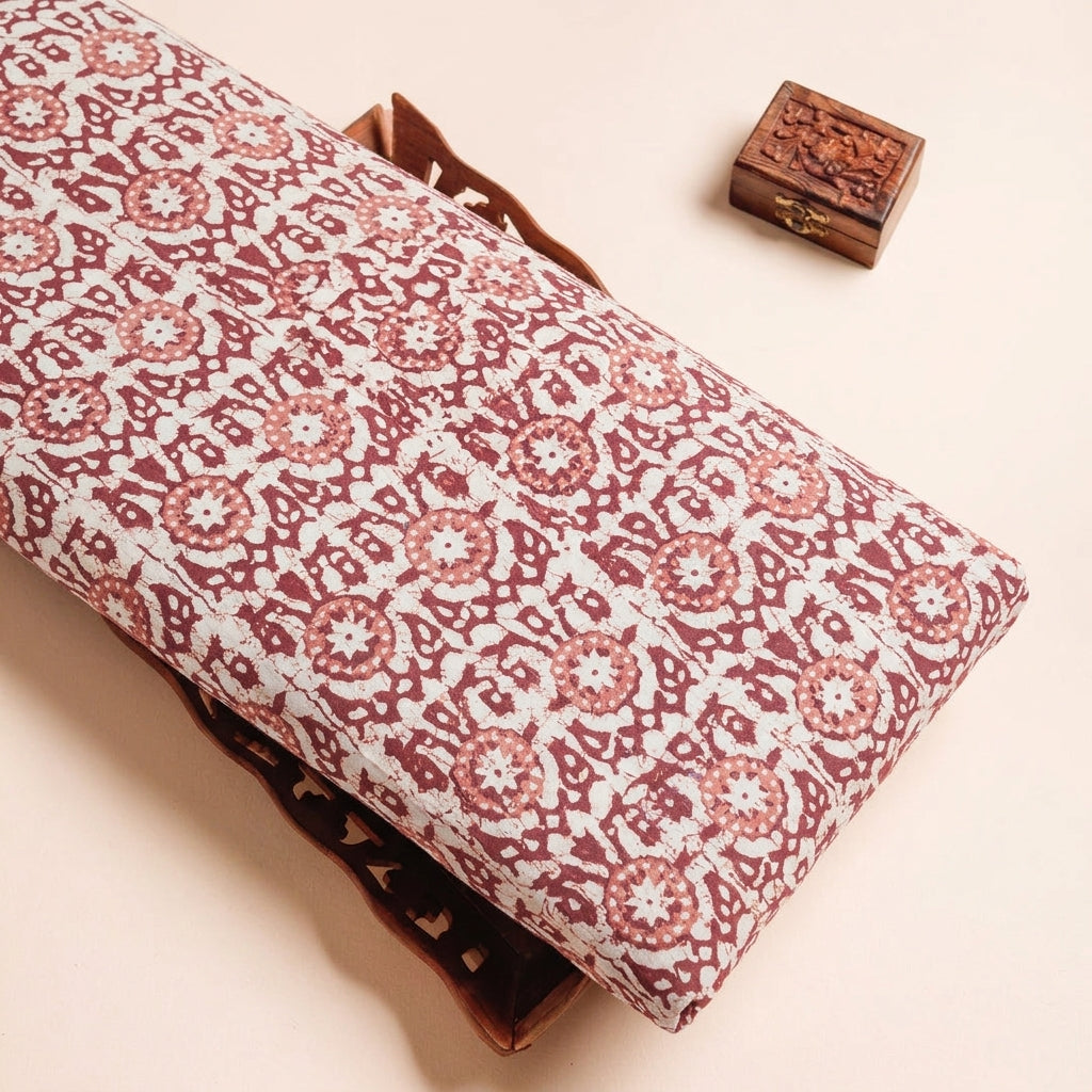 Batik Cream Batik Cotton Fabric on a wooden tray