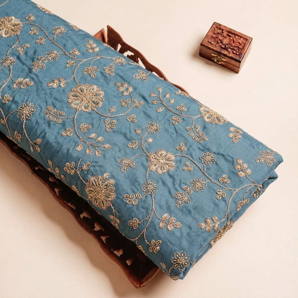 Folded Blue Embroidery Tissue Fabric Highlighting Sequin Thread work and Texture