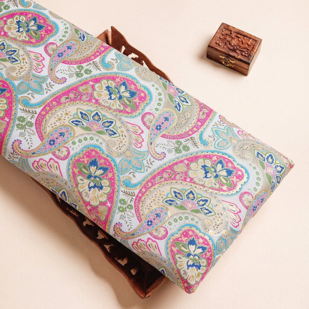 Paisley Cream Paisley Satin Fabric on a wooden tray