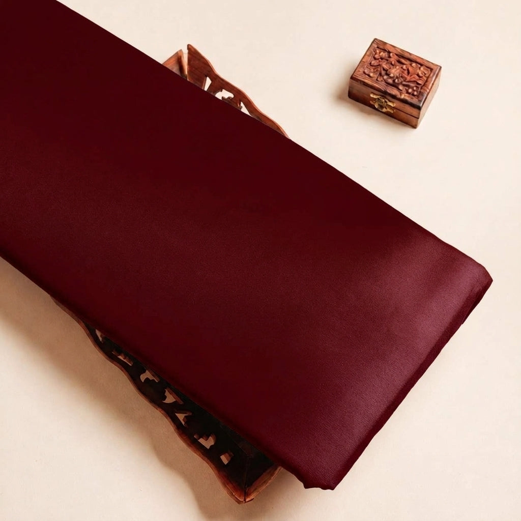 Folded Wine Plain Satin Fabric Highlighting Lining and Texture
