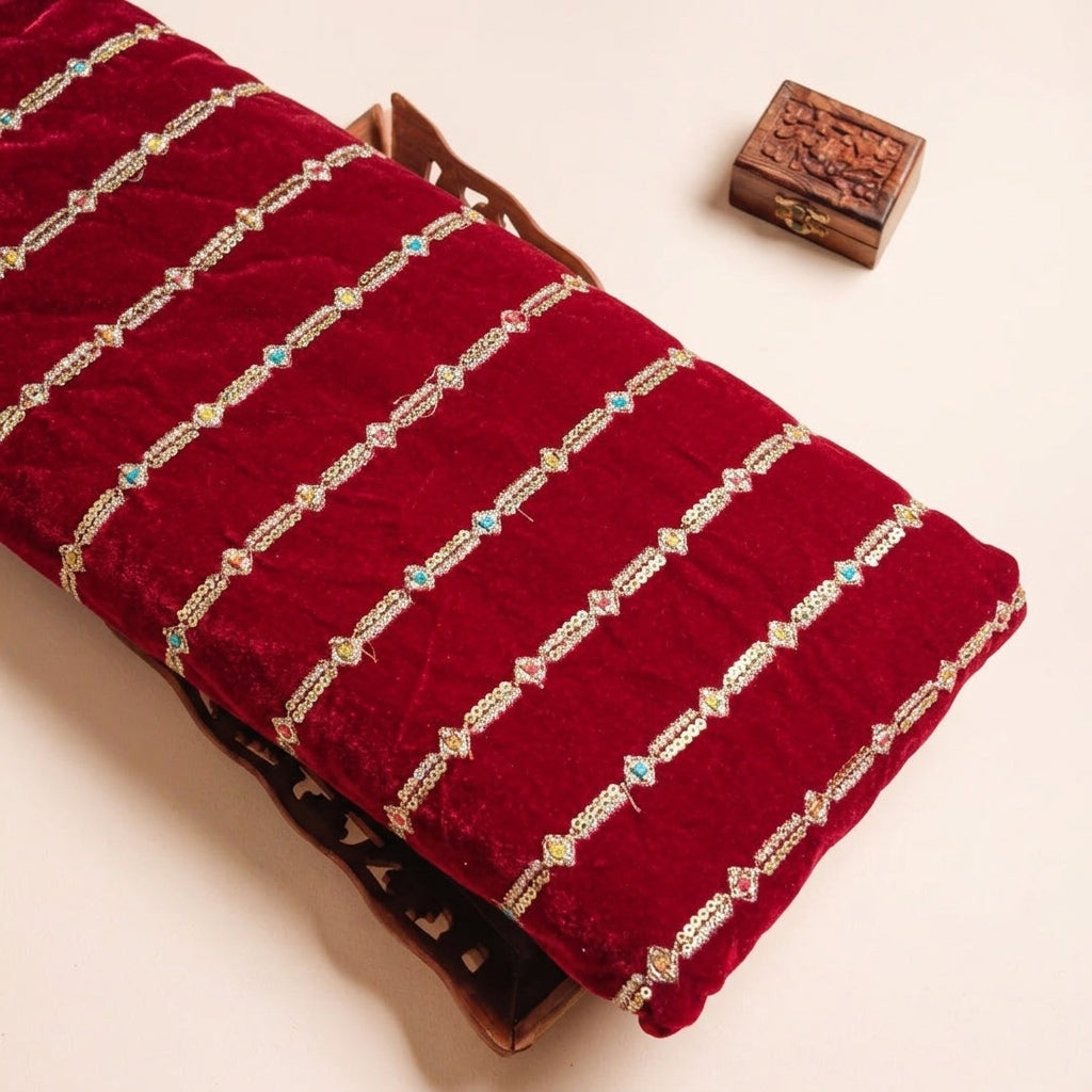 EMBROIDERY RED EMBROIDERY VELVET Fabric on a wooden tray