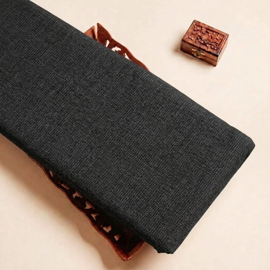 Folded Black Plain Cambric Cotton Fabric Highlighting and Texture