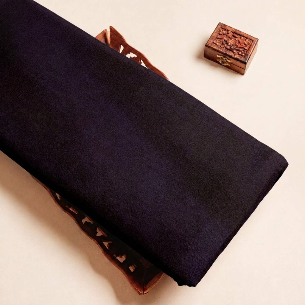 Folded Black Plain Satin Fabric Highlighting Lining and Texture