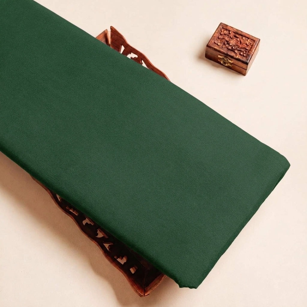 Folded Bottle Green Plain Crepe Fabric Highlighting Lining and Texture