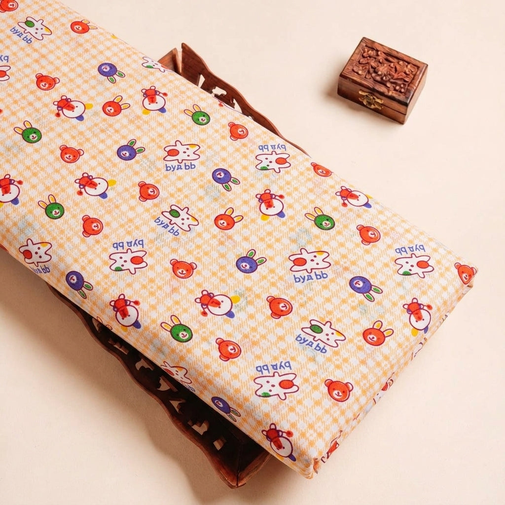 Folded Light Yellow Printed Cotton Fabric Highlighting Kids and Texture