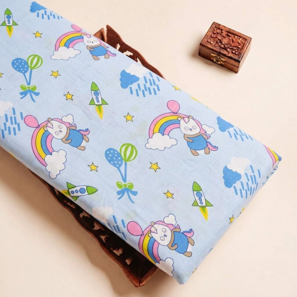 Folded Blue Printed Cotton Fabric Highlighting Kids and Texture