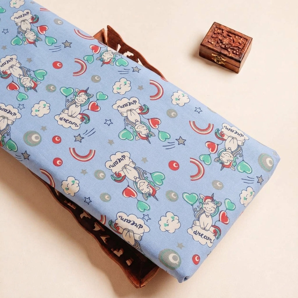 Folded Blue Printed Cotton Fabric Highlighting Kids and Texture