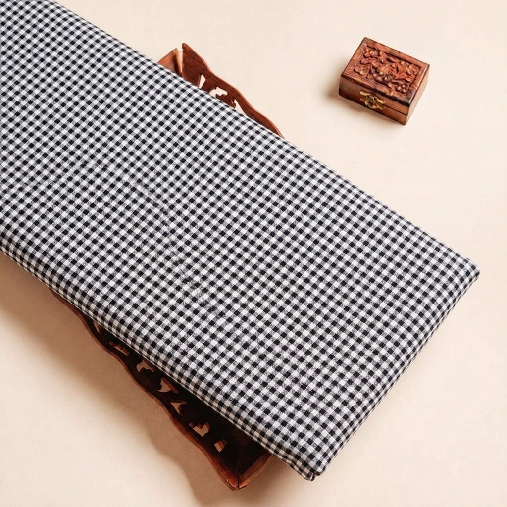 Folded Black Checked Terry Cotton Fabric Highlighting Cotton and Texture