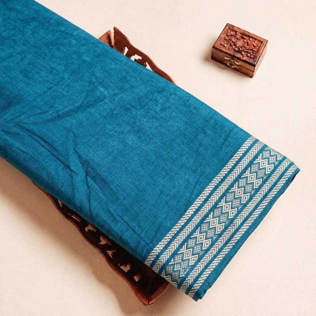 Folded Blue Zari Border Cotton Fabric Highlighting and Texture