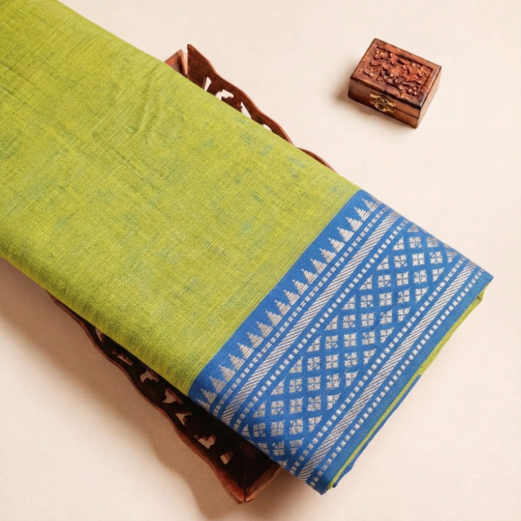 Folded Green Zari Border Cotton Fabric Highlighting and Texture