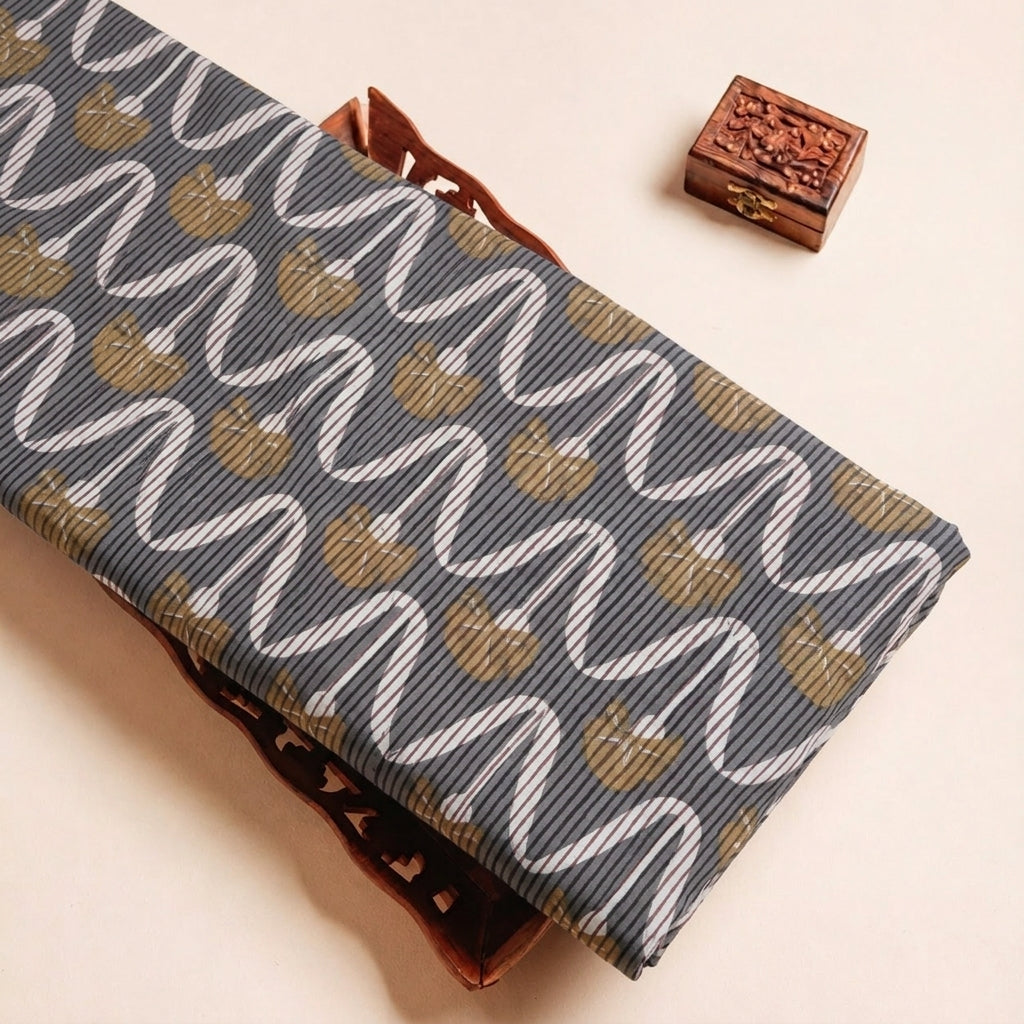 Folded Black Ajrakh Cotton Fabric Highlighting Floral and Texture