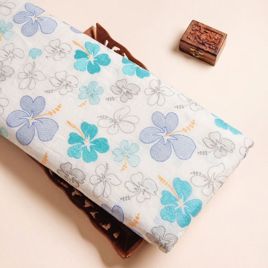 Embroidery Blue Embroidery Cotton Fabric on a wooden tray