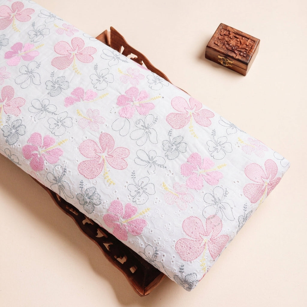 Embroidery Pink Embroidery Cotton Fabric on a wooden tray