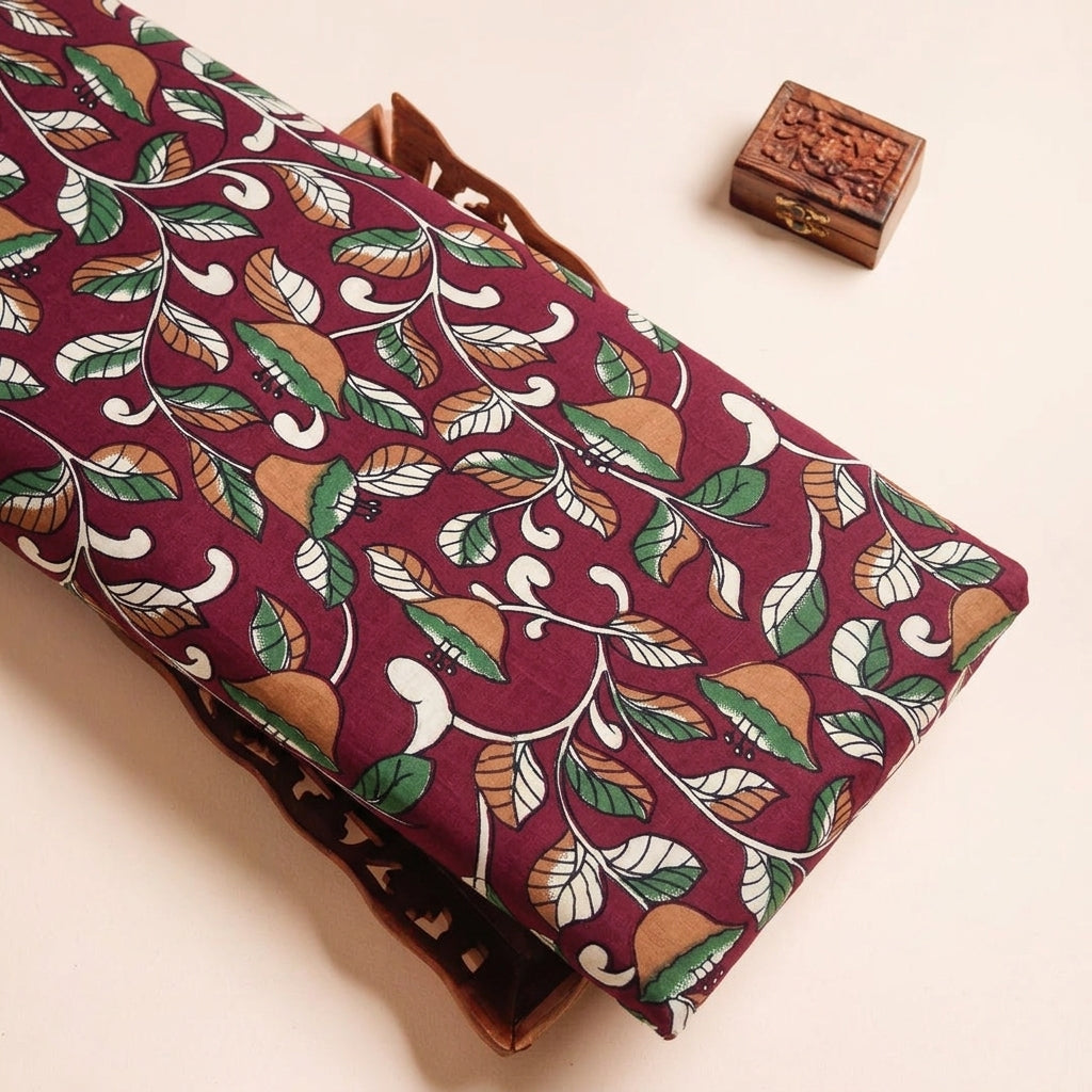 Floral Maroon Floral Cotton Fabric on a wooden tray