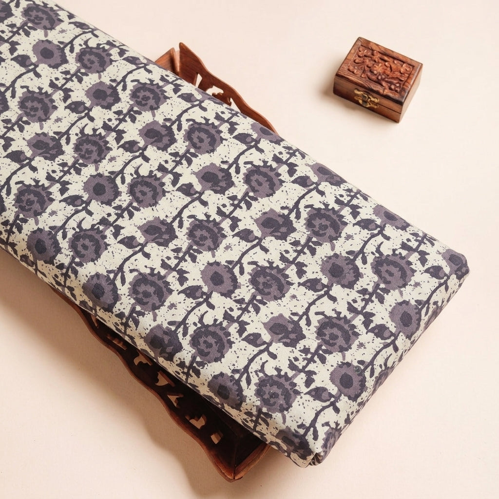 Batik Cream Batik Cotton Fabric on a wooden tray
