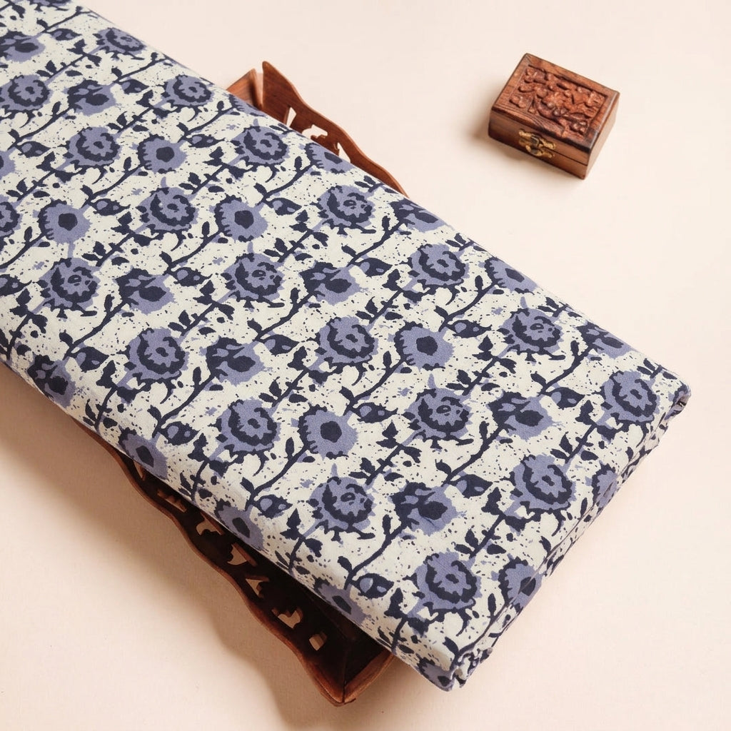 Batik Cream Batik Cotton Fabric on a wooden tray