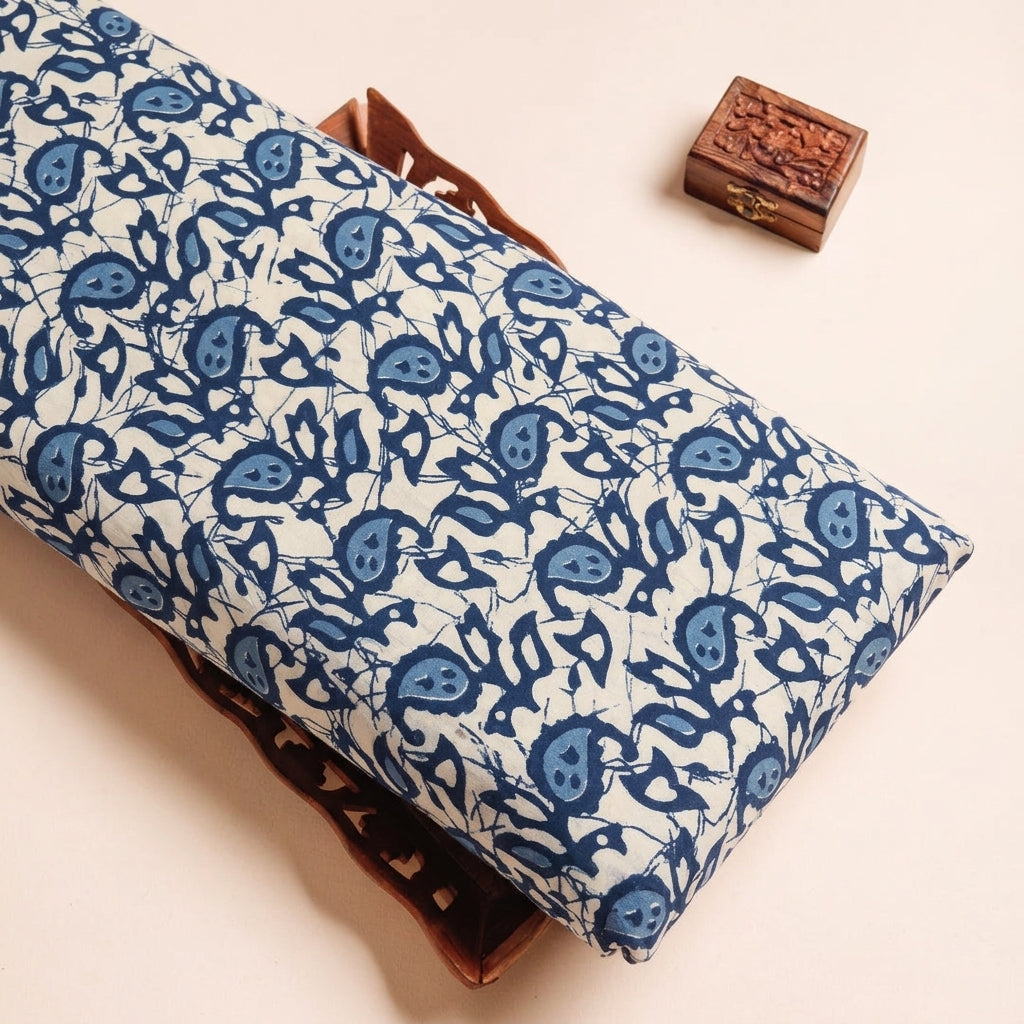 Batik Cream Batik Cotton Fabric on a wooden tray