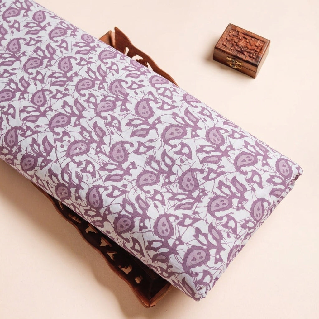 Batik Cream Batik Cotton Fabric on a wooden tray