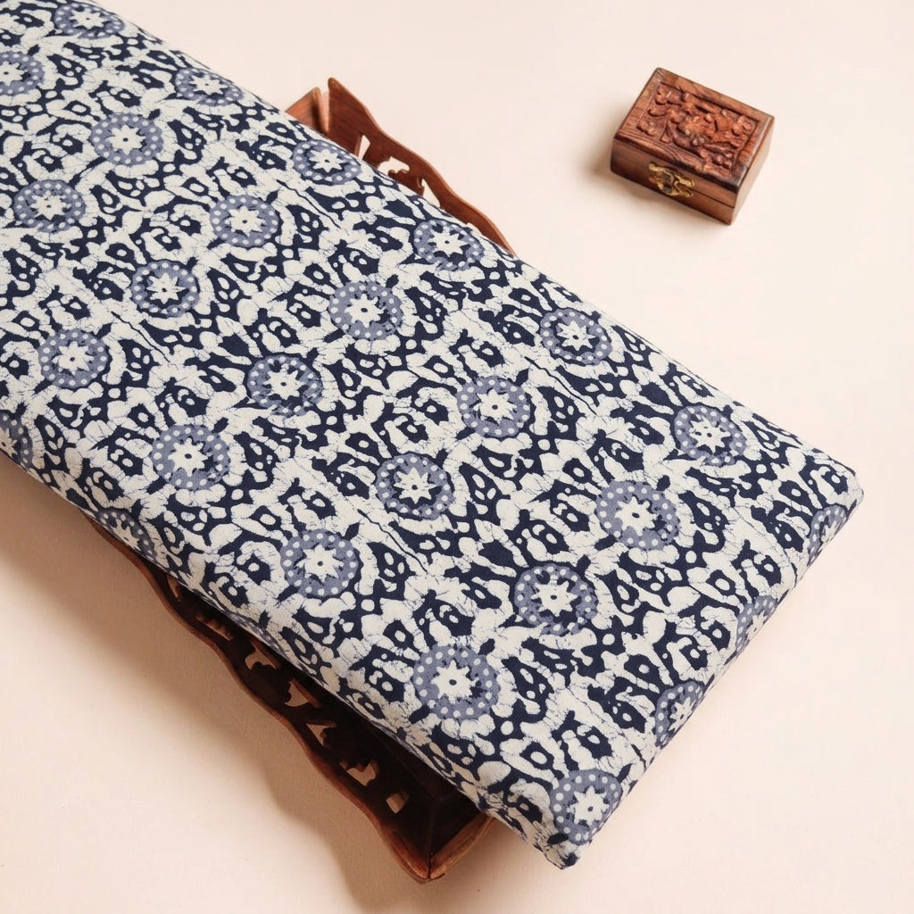 Batik Cream Batik Cotton Fabric on a wooden tray
