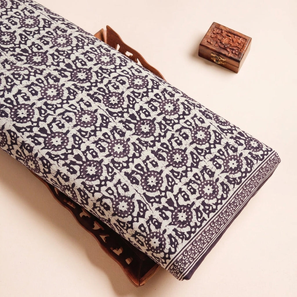 Batik Cream Batik Cotton Fabric on a wooden tray