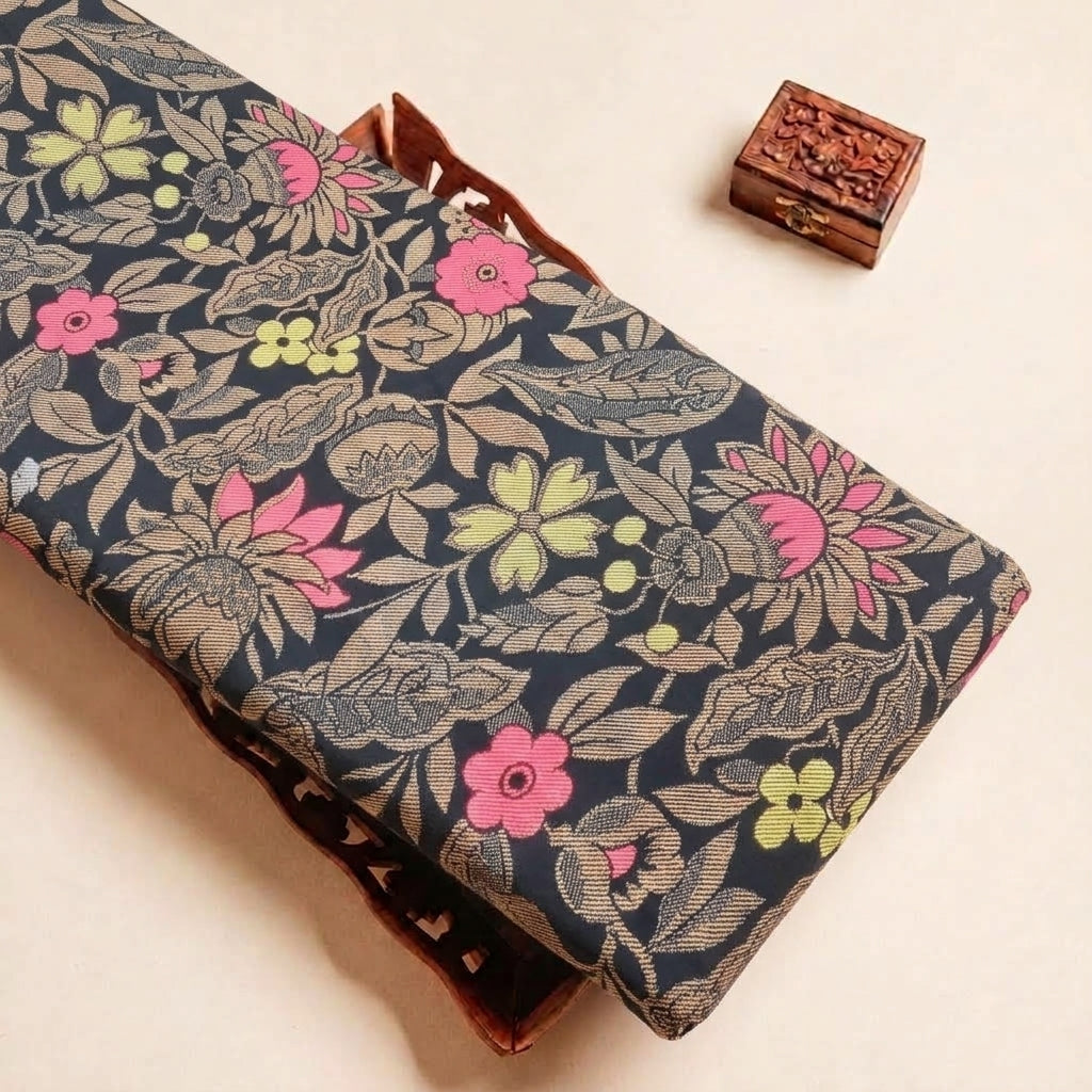 Folded Black Floral Satin Fabric Highlighting Texture