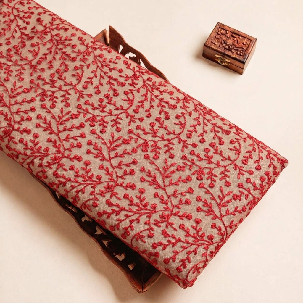 Folded Red Embroidery Lace Fabric Highlighting Floral and Texture