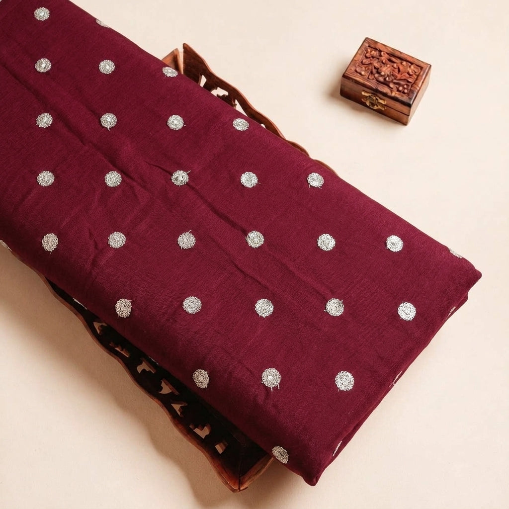 Folded Maroon Embroidery Chinnon Fabric Highlighting Butta and Texture