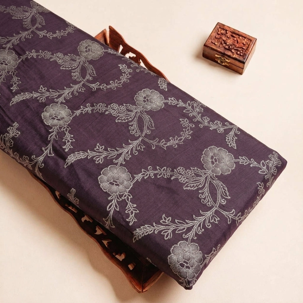 Folded Brown Floral Viscose Organza Fabric Highlighting Zari and Texture