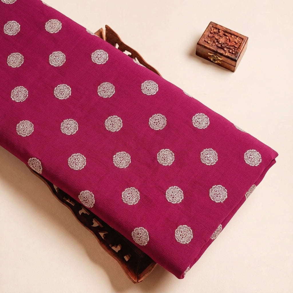 Folded Maroon Floral Viscose Organza Fabric Highlighting Zari and Texture