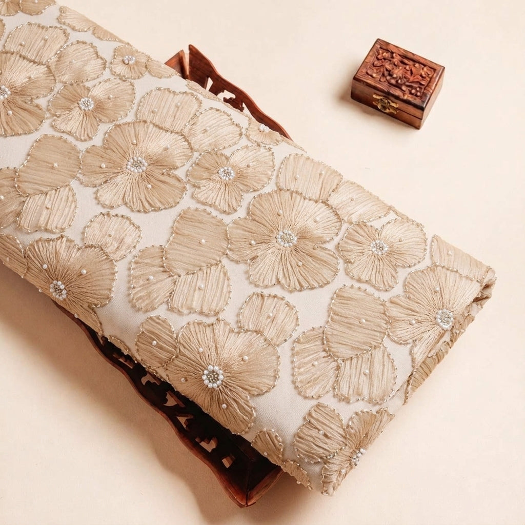 Folded Beige Floral Embroidery Net Fabric Highlighting Floral Stone and Texture
