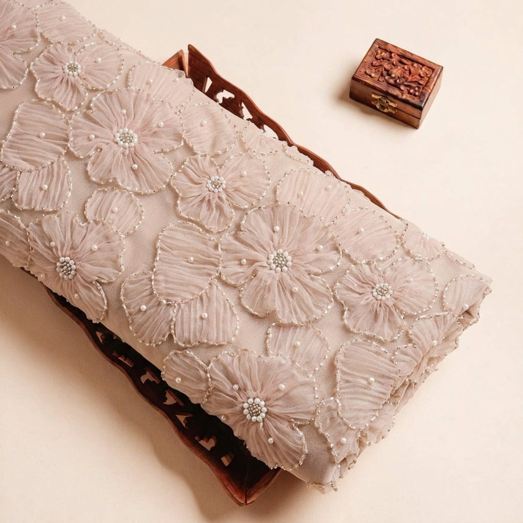 Folded Pink Floral Embroidery Net Fabric Highlighting Floral Stone and Texture