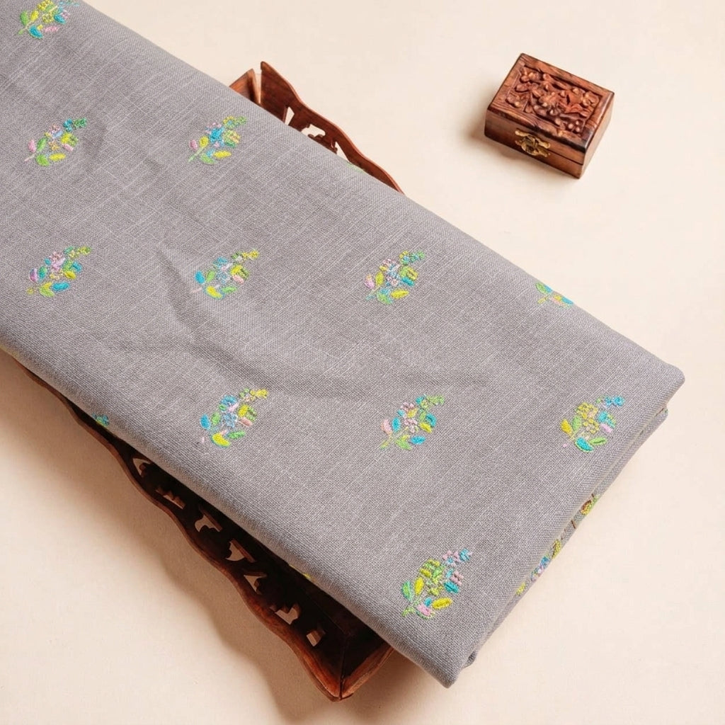 Folded Muave Embroidery Linen Fabric Highlighting Floral Seqiun and Texture