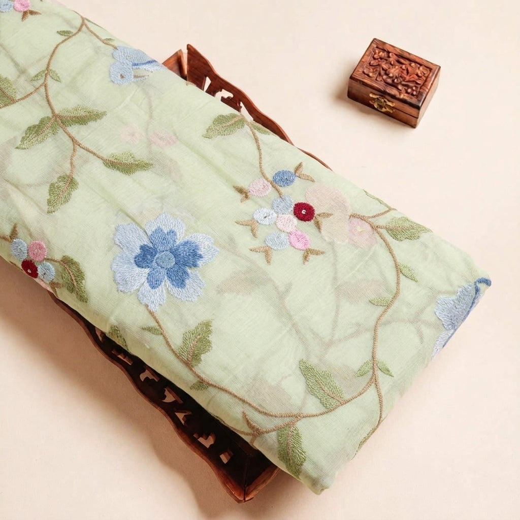 Folded Light Green Embroidery Chanderi Fabric Highlighting Floral Thread Work Cotton and Texture