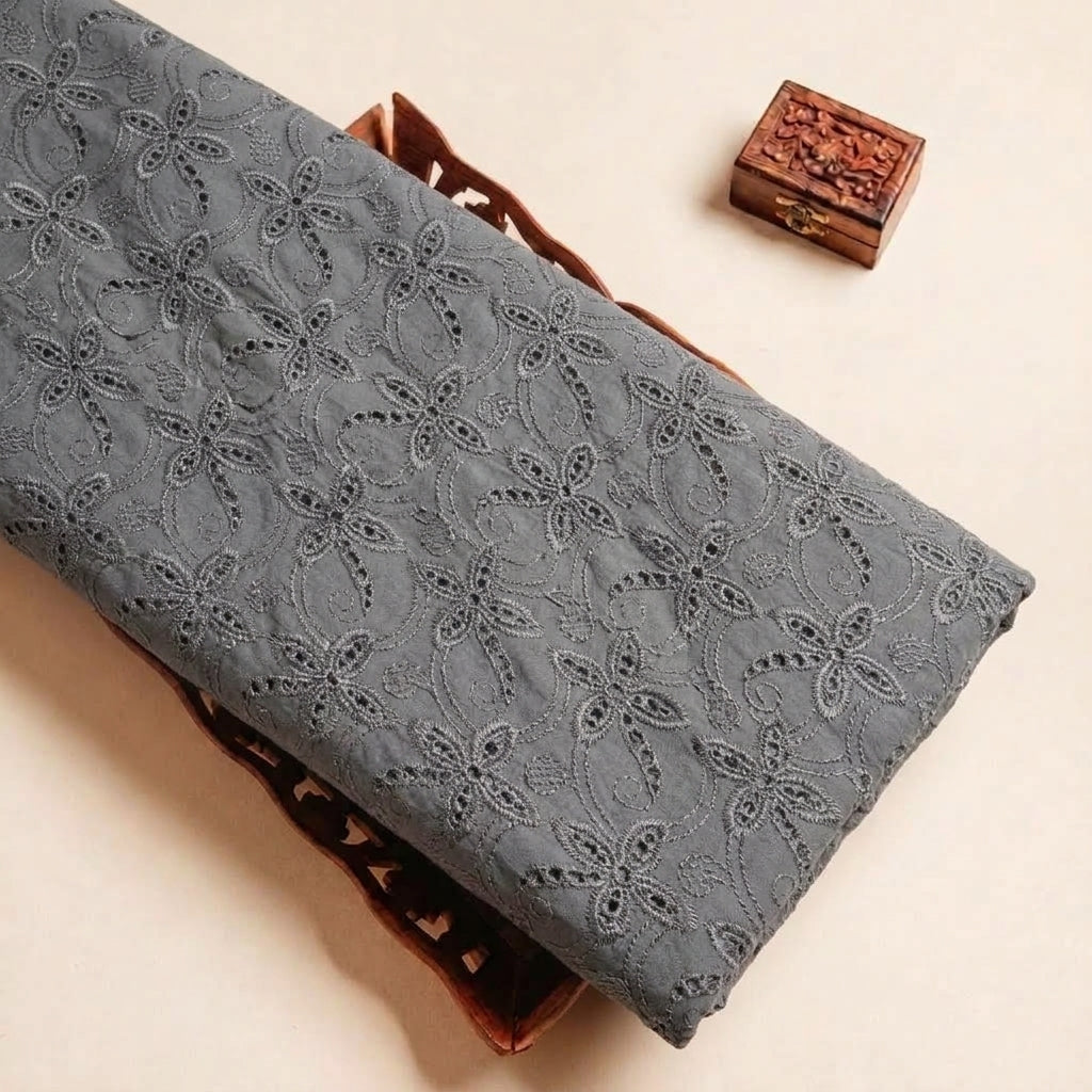 Folded Black Embroidery Cotton Fabric Highlighting Floral and Texture