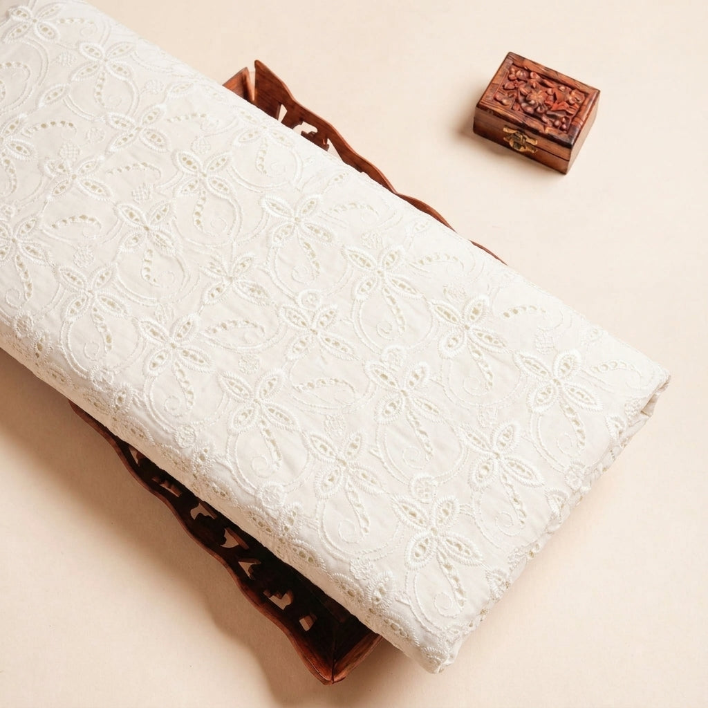 Folded Cream Embroidery Cotton Fabric Highlighting Floral and Texture