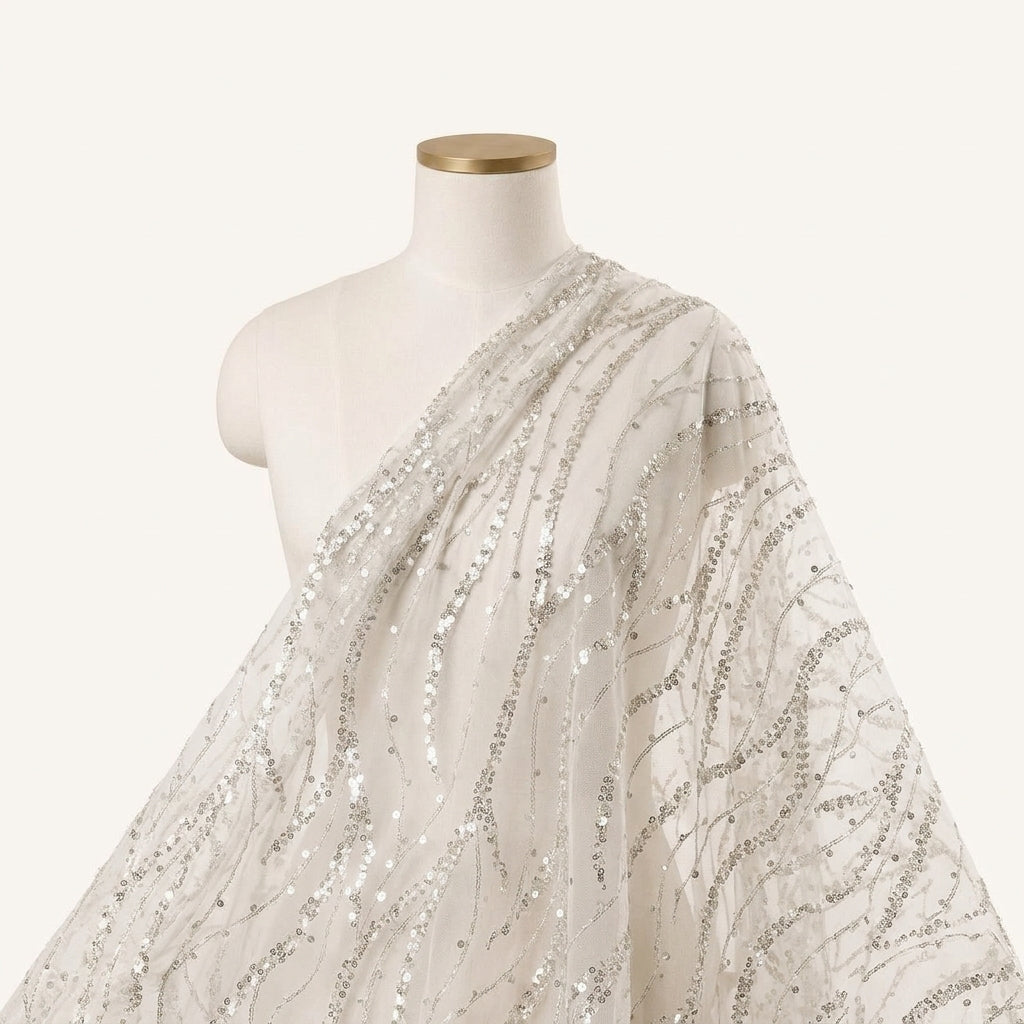 Embroidery White Embroidery Net Fabric Draped as a saree