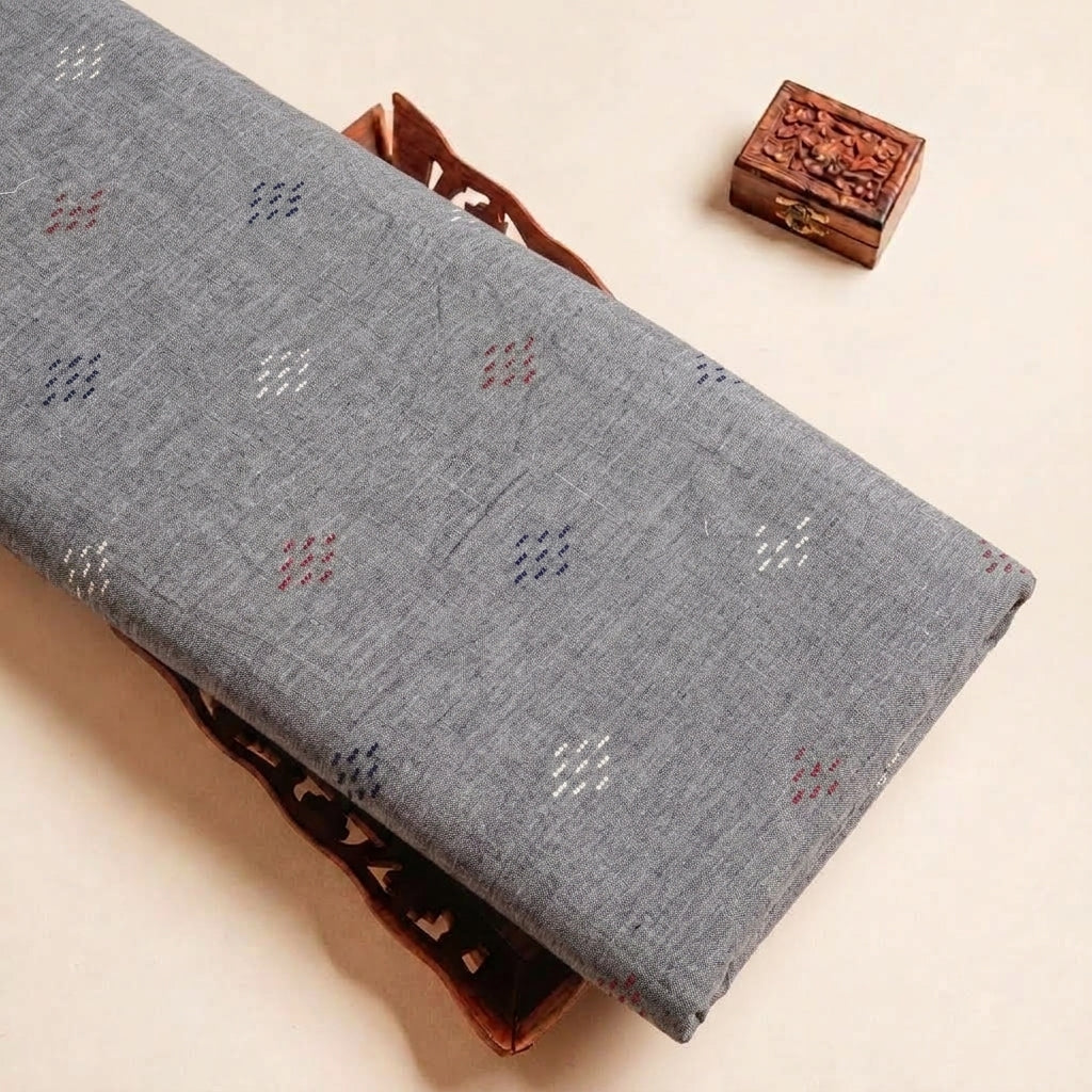 Folded Grey Embroidery Jacquard Fabric Highlighting Thread Work and Texture