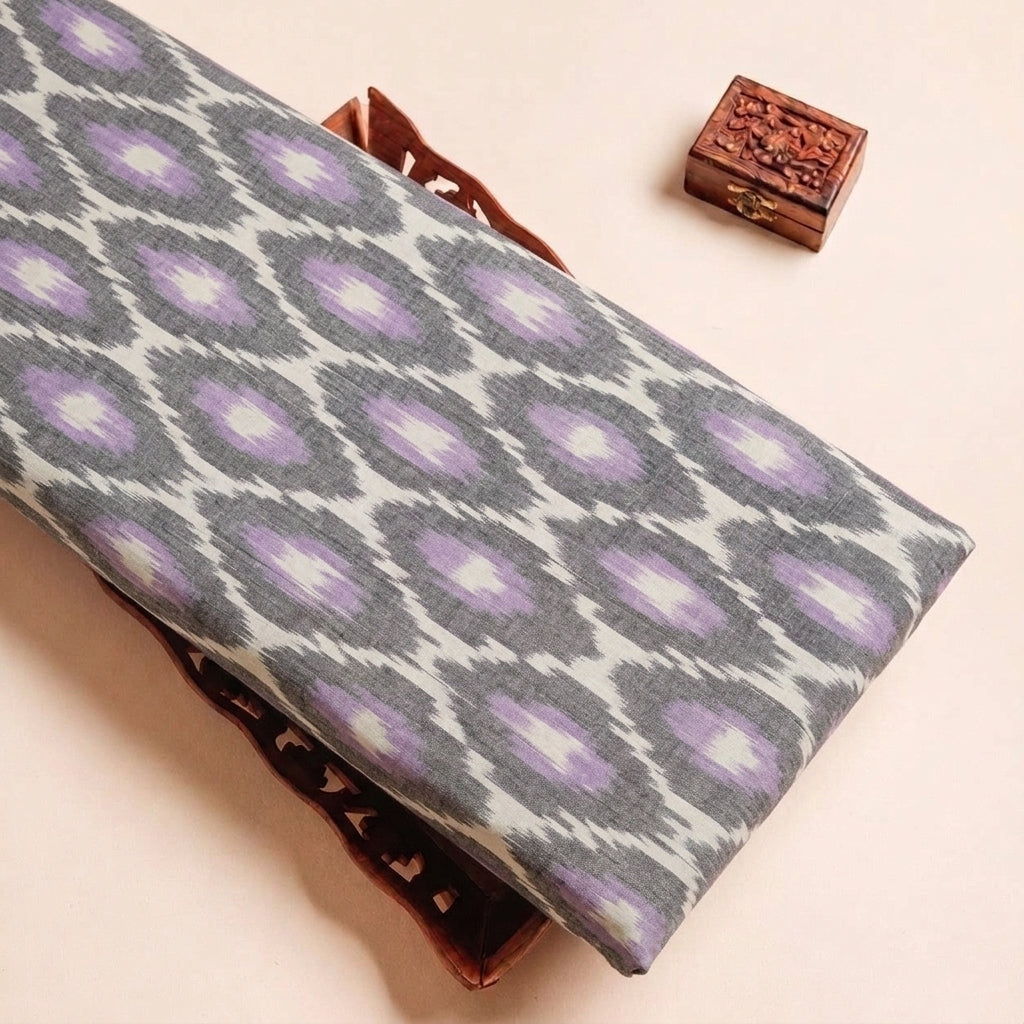 Folded Grey Ikat Cotton Fabric Highlighting Texture