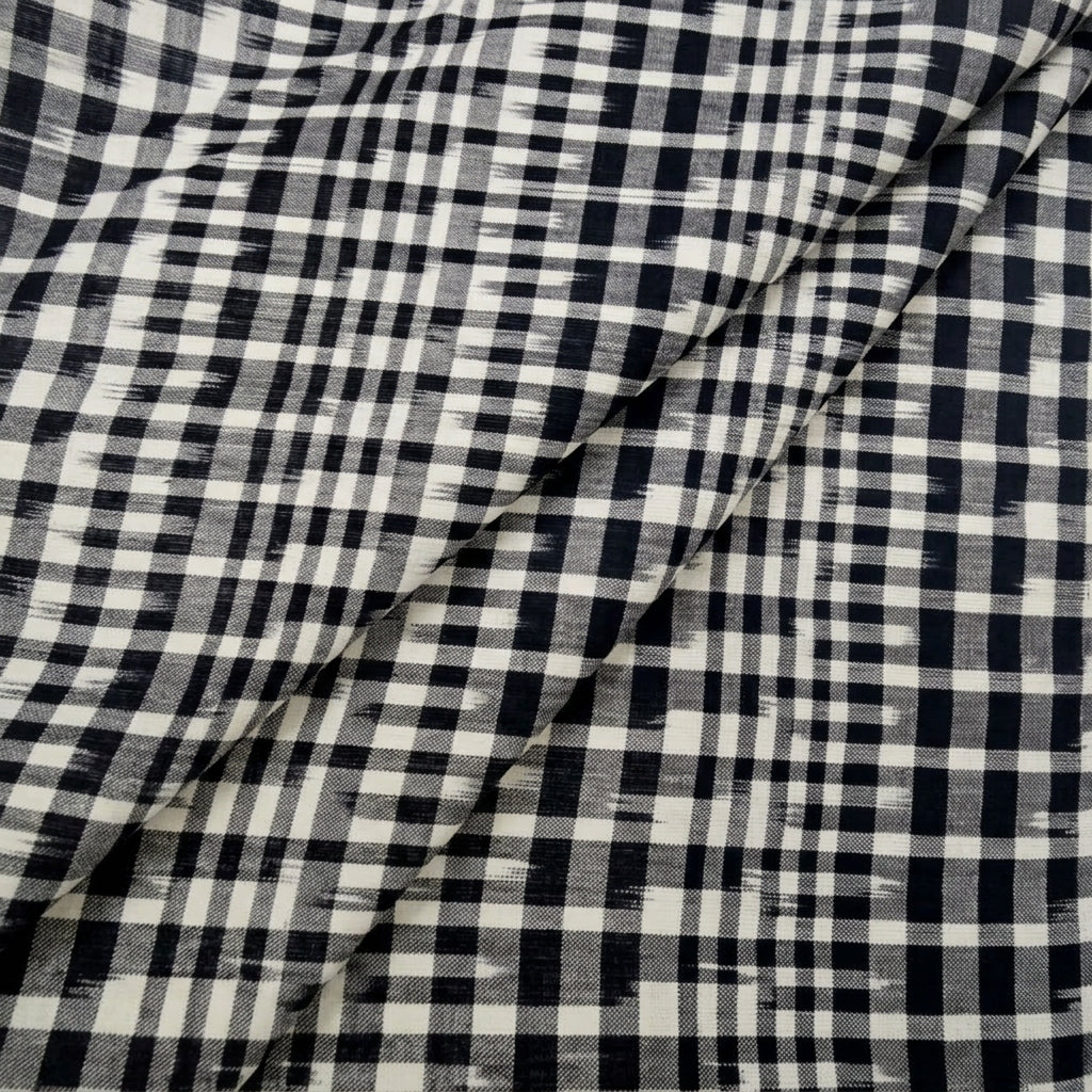 Folded White Ikat Cotton Fabric