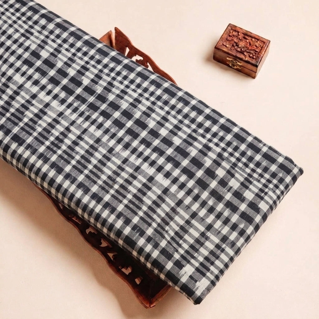 Folded White Ikat Cotton Fabric Highlighting Texture