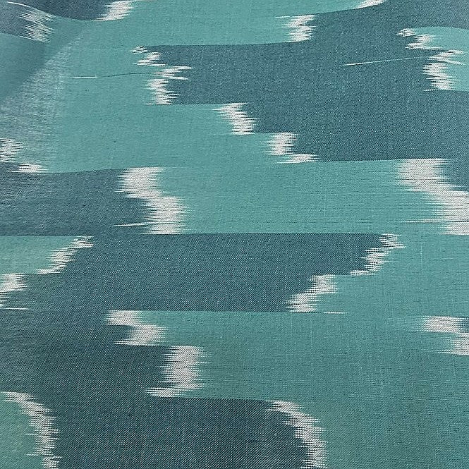Green Ikat Cotton Fabric, laid flat