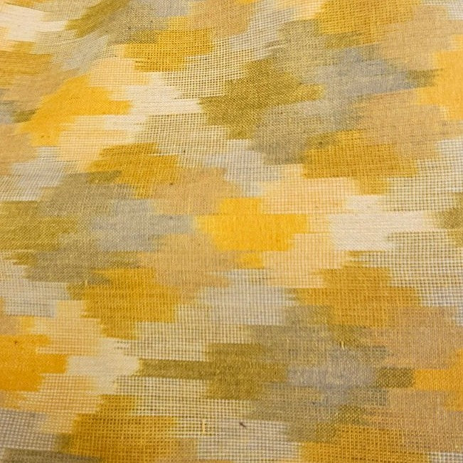Yellow Ikat Cotton Fabric, laid flat