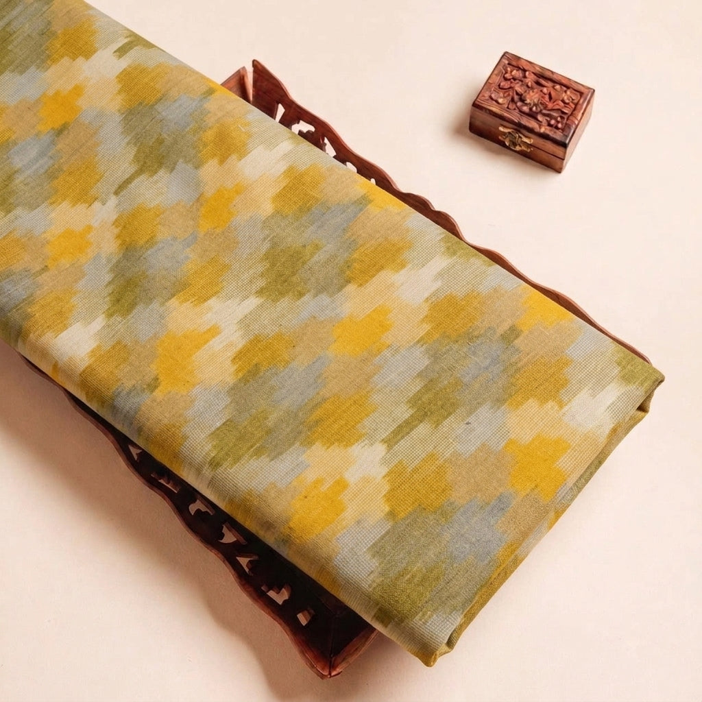 Folded Yellow Ikat Cotton Fabric Highlighting Texture