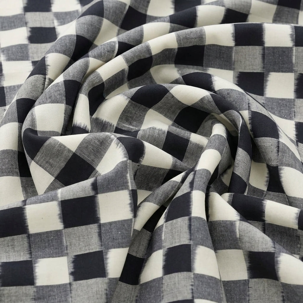 White Ikat Cotton Fabric, swirled to show the drape