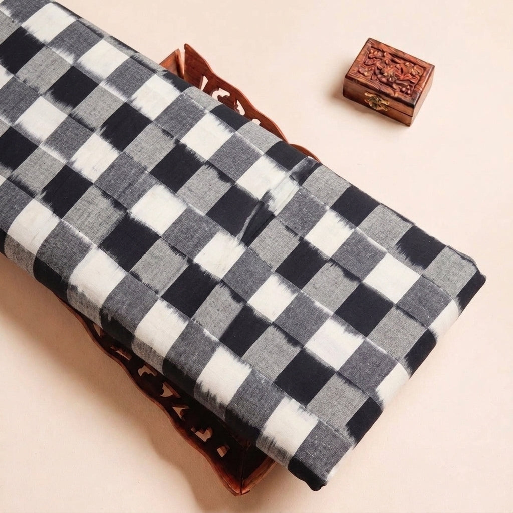 Folded White Ikat Cotton Fabric Highlighting Texture
