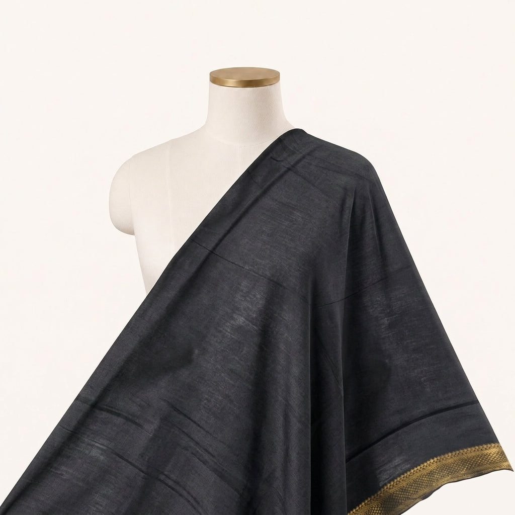 Black Zari Cotton Fabric Draped as a saree