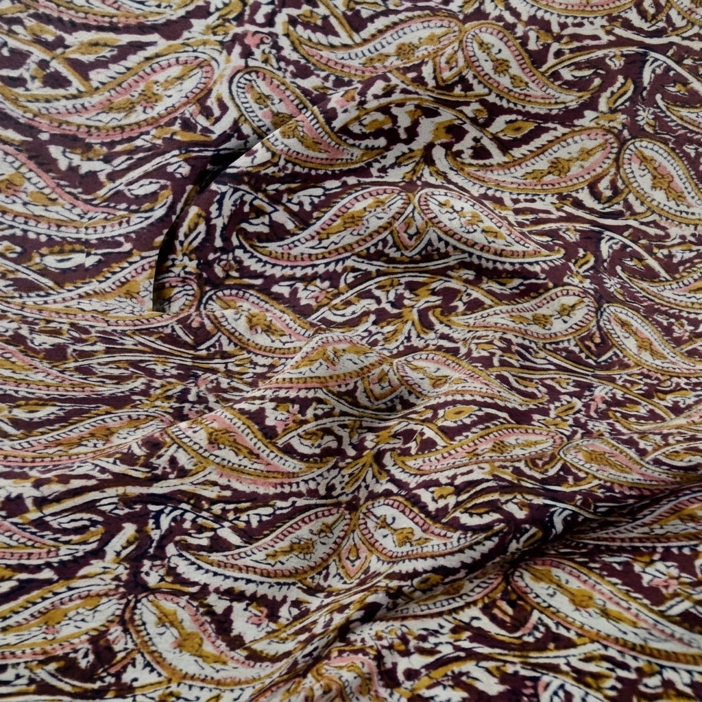 Maroon Kalamkari Cotton Fabric, swirled to show the drape