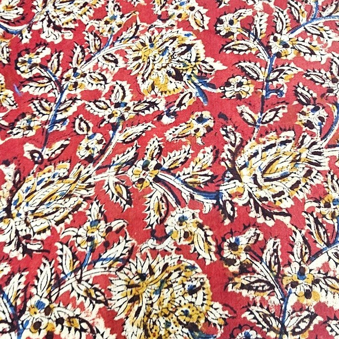 Red Kalamkari Cotton Fabric, laid flat