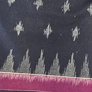 Black Ikat Cotton Fabric, laid flat