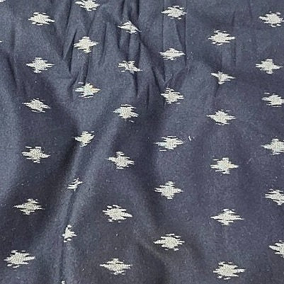 Black Ikat Cotton Fabric, laid flat
